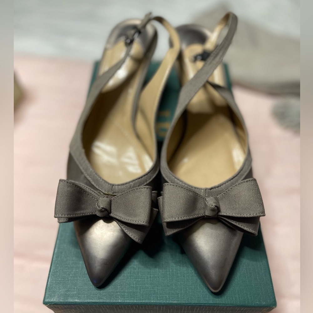 Pewter colored dress shoe.